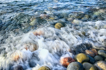 colored stones round the sea / texture wet rounded stones, wet multi-colored summer background