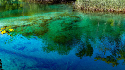 Plitvice Lakes National Park. Croatia’s most popular tourist attraction. Small rivers, waterfalls  and lakes in the forest. Natural beauty mountainous region. Pedestrian routes. Summer. Europe.