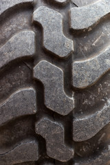 Closeup of a big tractor tire. Tire tread