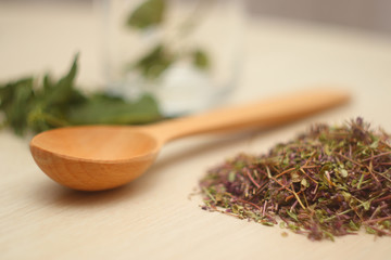 Dried stems and leaves of a medicinal plant as tea leaves. Natural ingredients for the tea ceremony. Do-it-yourself healthy drink.