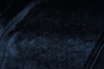 velvet texture dark blue color background , expensive luxury fabric, wallpaper. copy space