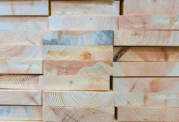 Stack of new wood planks for carpentry, background, close up