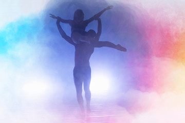 Two Young modern dancers dancing in the studio. Sport, dancing and urban culture concept. Group of young dancers performing on the stage. Effective performance. beautiful dance. 