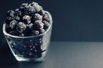 frozen blackcurrant close up on dark background