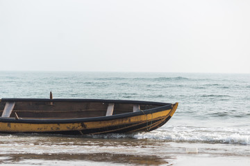 Isolated boat standing on beach, Rushikonda beach, Vizag, India
