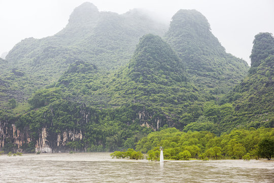 Passing a beacon near the Mopanshan wharf navigating on the Li River near Guilin