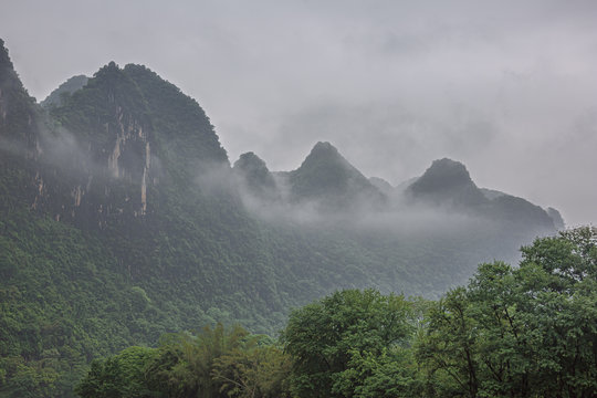 Hills covered in fog on the Li River near Guilin