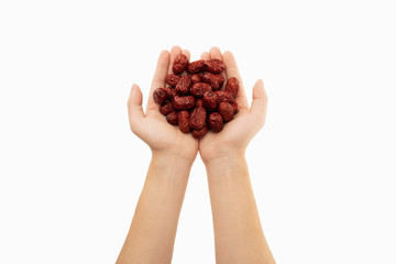 jujube in hands with white background