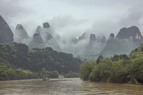 Hills bordering the Li River closing in the valley in the vicinity of Yangshuo near Guilin