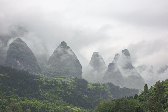 Heavy clouds covering the hills bordering the Li River in the vicinity of Yangshuo near Guilin