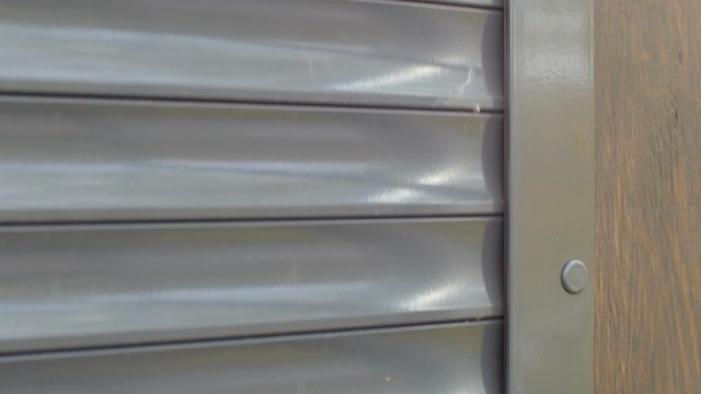 roller shutter closed close up, safety concept, loopable