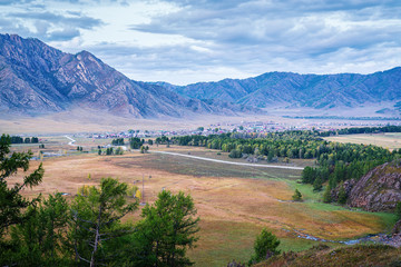 Fototapeta premium Evening mountain landscape after sunset. Russia, mountain Altai, Ongudaysky district, the village of Karakol