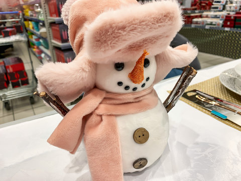 Decorative textule funny snowmen on a shelf at christmas market fair in mall