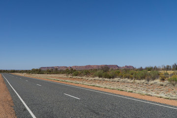 Fototapeta na wymiar on the horizon in the Australian outback you can see the Kings Canyon
