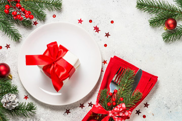 Christmas table setting on white top view.