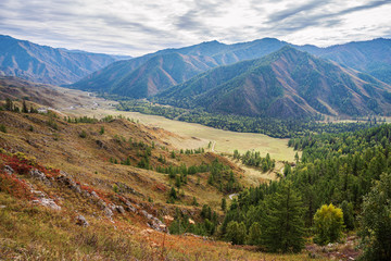 Serpentine mountain road. View of the Chuysky tract from the Chike-Taman pass, Altai mountains, Russia