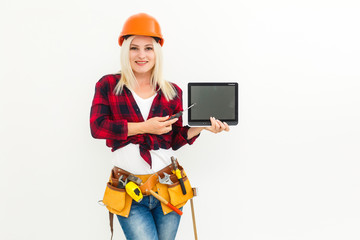 working woman in helmet with tablet isolated on white
