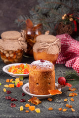 Obraz na płótnie Canvas Italian sweet dessert panettone. rich Italian bread made with eggs, fruit, and butter and typically eaten at Christmas. copy space