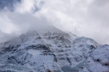 View of snow alp mountain landscape in autumn nature at swiss