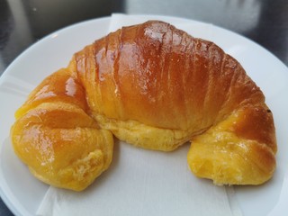 croissant with jam on a plate
