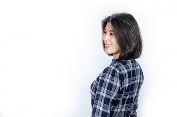 Beautiful smiling woman with clean skin, natural make-up, and white teeth on grey background