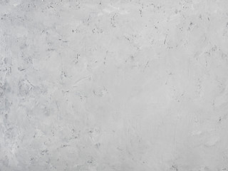 Gray concrete background with white stains and spots