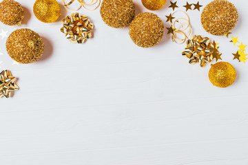Christmas flat lay frame of golden decorations