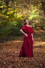 Portrait of a teenage girl in red dress
