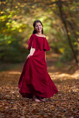 Portrait of a teenage girl in red dress