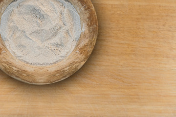 Teff flour in a wooden container