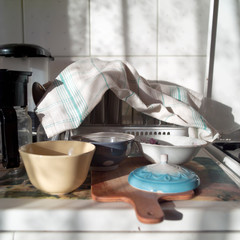 kitchen utensils covered with towel