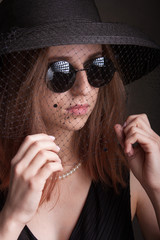 portrait of a young girl in the style of rock.
