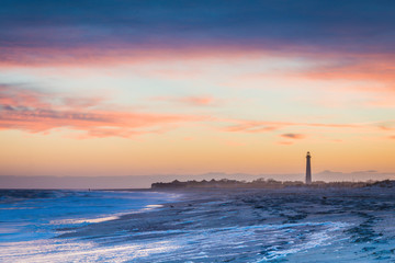 Cape May NJ lighthouse and Atlantic Ocean at sunset in springtime  - obrazy, fototapety, plakaty
