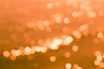 Orange color background with blurred lights and bokeh