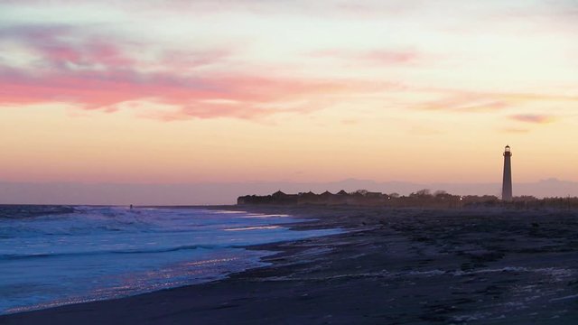 Cape May NJ lighthouse and Atlantic Ocean at sunset in springtime 