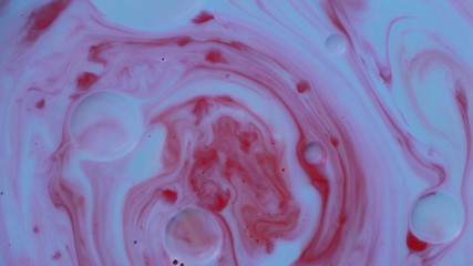 Abstract liquid ink painting texture. Blue and red color swirl marble background. Psychedelic.