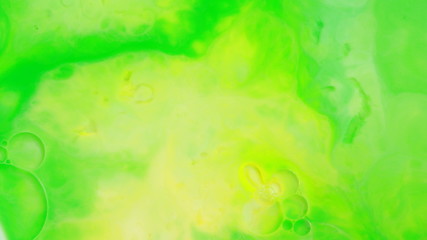 Fototapeta na wymiar Abstract liquid ink painting texture. Green and yellow color swirl marble background. 