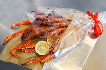 Bouquet of huge crab and other seafood, fish, large shrimp.