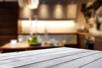 Table background of free space and blurred home interior 