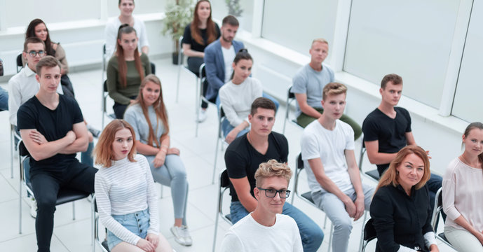 top view. listeners business seminar sitting in a bright room.