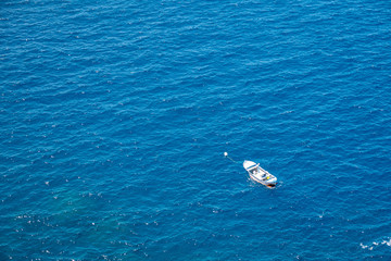 fishing boat viewed from above in a beautiful blue sea