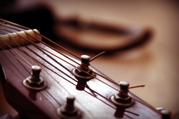 Acoustic classic guitar fretboard with tuner and strings