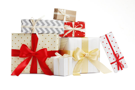 Different Christmas gift boxes on white background
