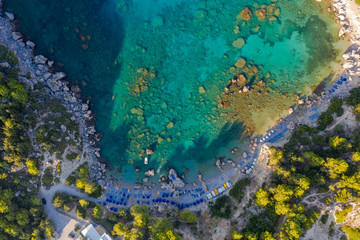 Fototapeta na wymiar Aerial birds eye view drone photo Anthony Quinn near Ladiko bay on Rhodes island, Dodecanese, Greece. Panorama with nice lagoon and clear blue water. Famous tourist destination in South Europe.