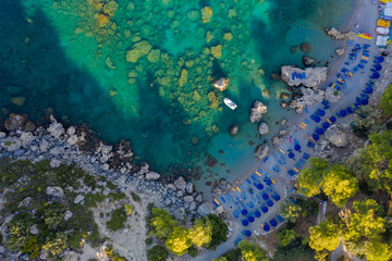 Fototapeta na wymiar picturesque Bay of sea with beach rocks and stones, clear turquoise water, view from the drone
