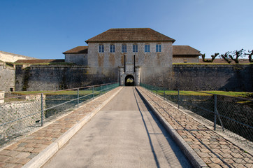 View of the gate to the old citadel of Besancon, France from the bridge over the moat. There are...