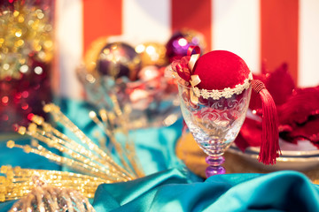 Festive table setting with plush chrismas bauble in cup