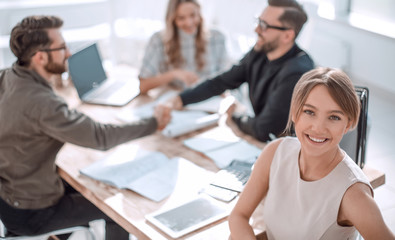 young business woman with a digital tablet at a business meeting
