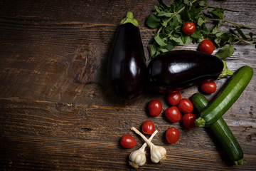 Still life of eggplants and other vegetables