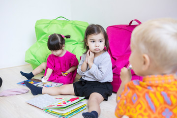 Fototapeta premium Group of little kids learning in the kindergarten